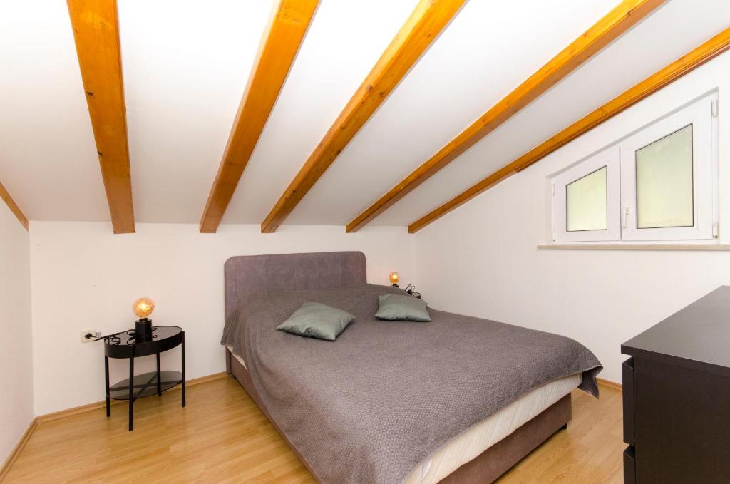Postel nebo postele na pokoji v ubytování House Ratac