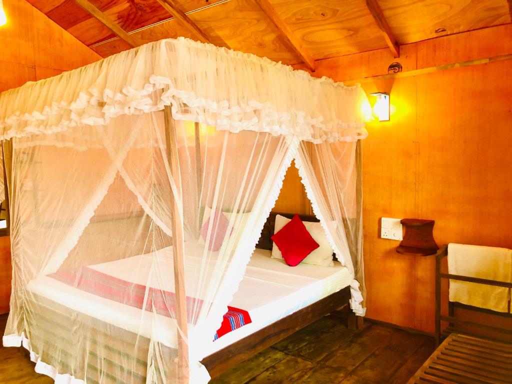 Postel nebo postele na pokoji v ubytování Sungreen Cottage Sigiriya
