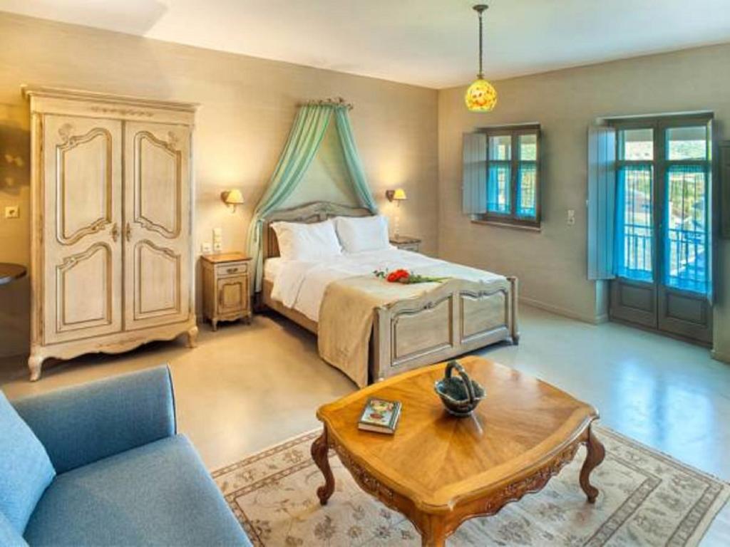 A bed or beds in a room at Haones Suites