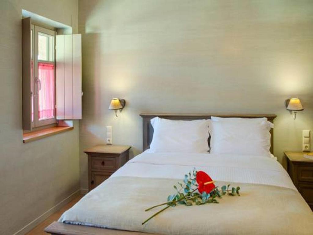A bed or beds in a room at Haones Suites