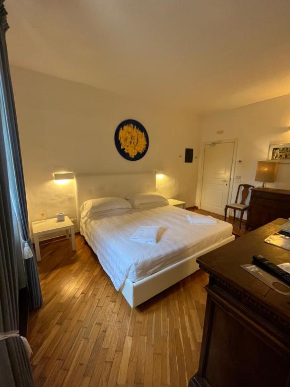 Posteľ alebo postele v izbe v ubytovaní Villa I Barronci Resort & Spa
