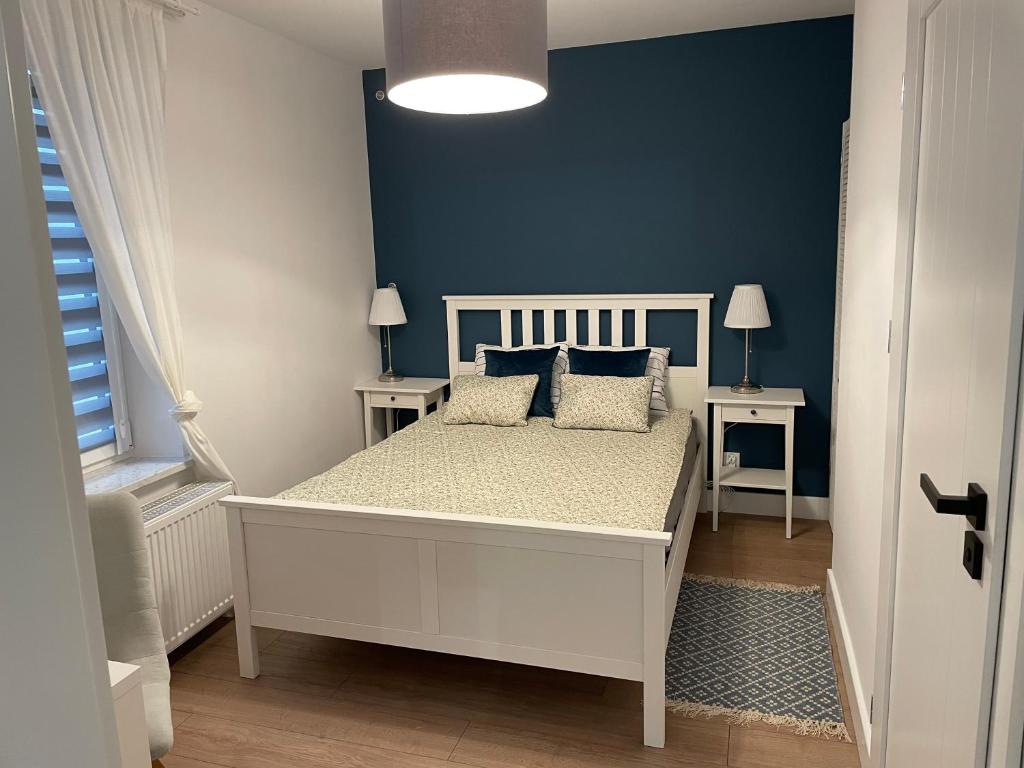 Ένα ή περισσότερα κρεβάτια σε δωμάτιο στο A.S.Apartament A Okrzei 4