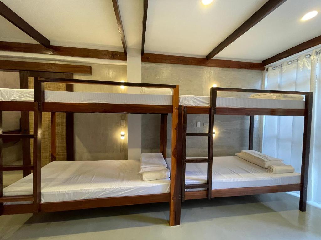 Postel nebo postele na pokoji v ubytování Dahun Villas Siargao