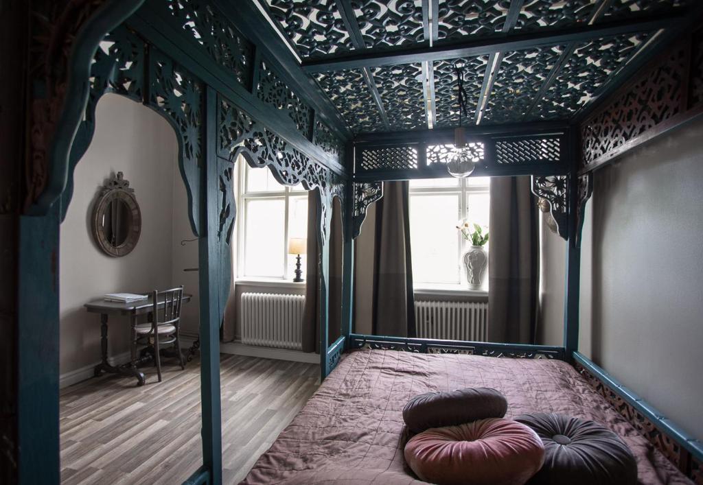 Postel nebo postele na pokoji v ubytování Vandrarhemmet Vindarnas Hus