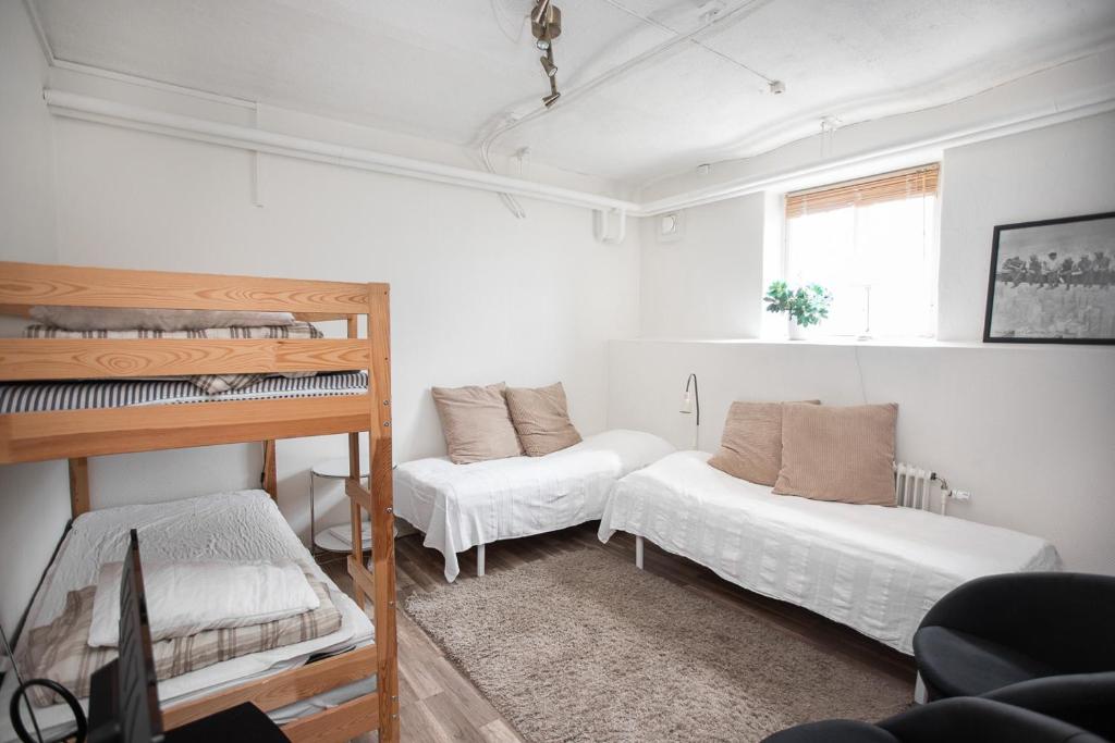Postel nebo postele na pokoji v ubytování Vandrarhemmet Vindarnas Hus
