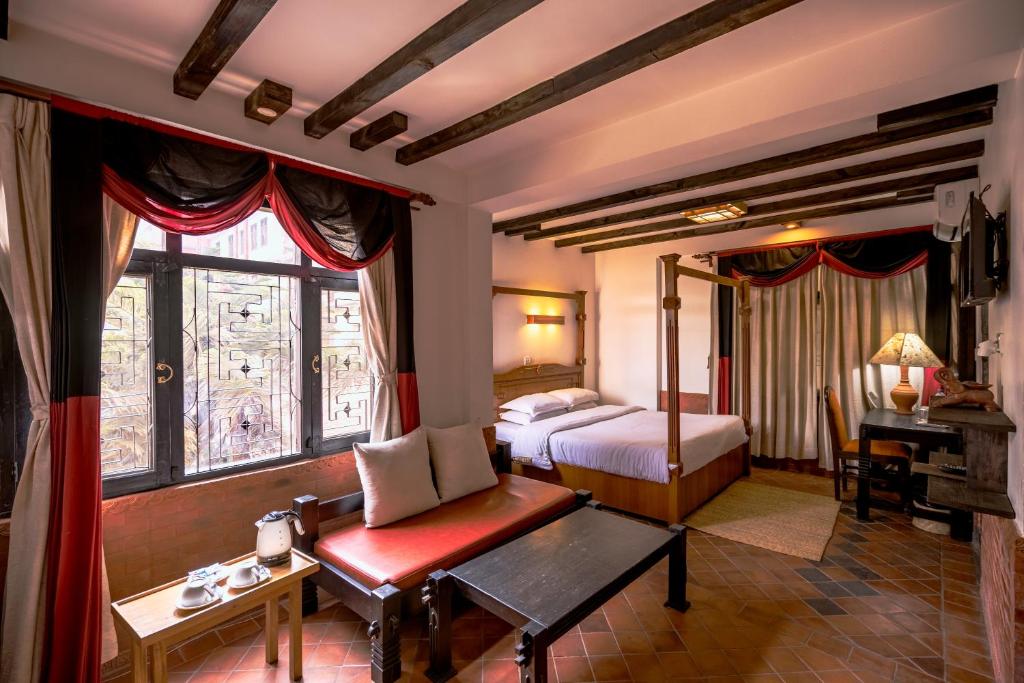 Postel nebo postele na pokoji v ubytování Hotel Ganesh Himal