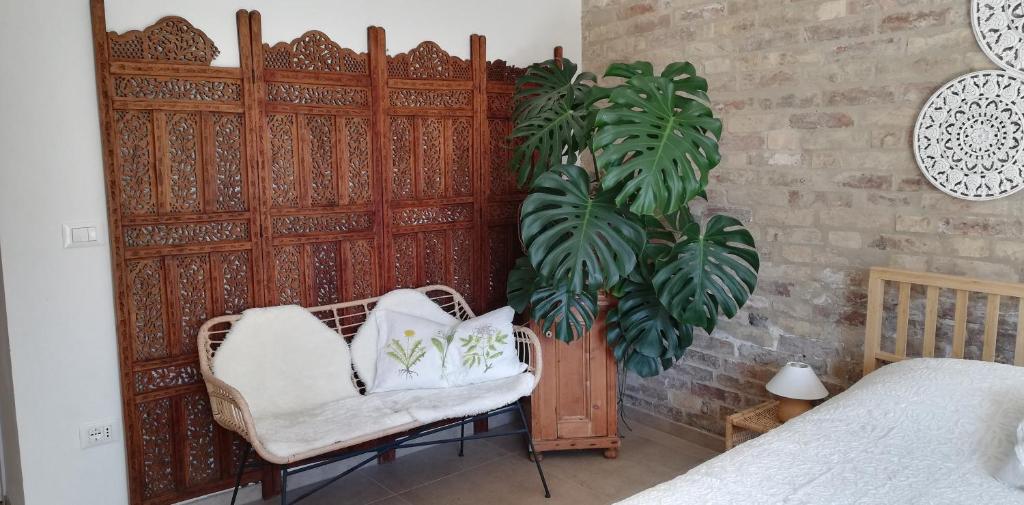 A bed or beds in a room at La mia Casa nelle Marche