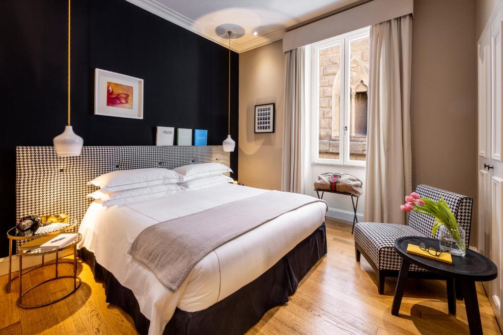 Postel nebo postele na pokoji v ubytování Nerva Boutique Hotel