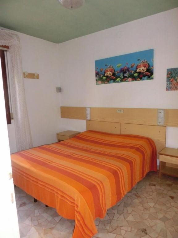 A bed or beds in a room at Beautiful flat 250m from the beach for 8 guests