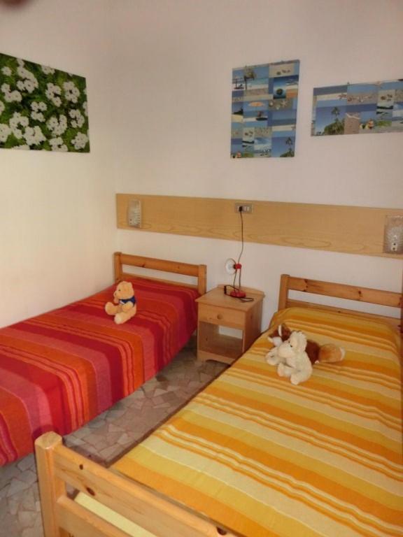 A bed or beds in a room at Beautiful flat 250m from the beach for 8 guests