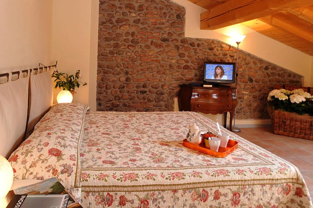 Postel nebo postele na pokoji v ubytování Agriturismo Al Barco
