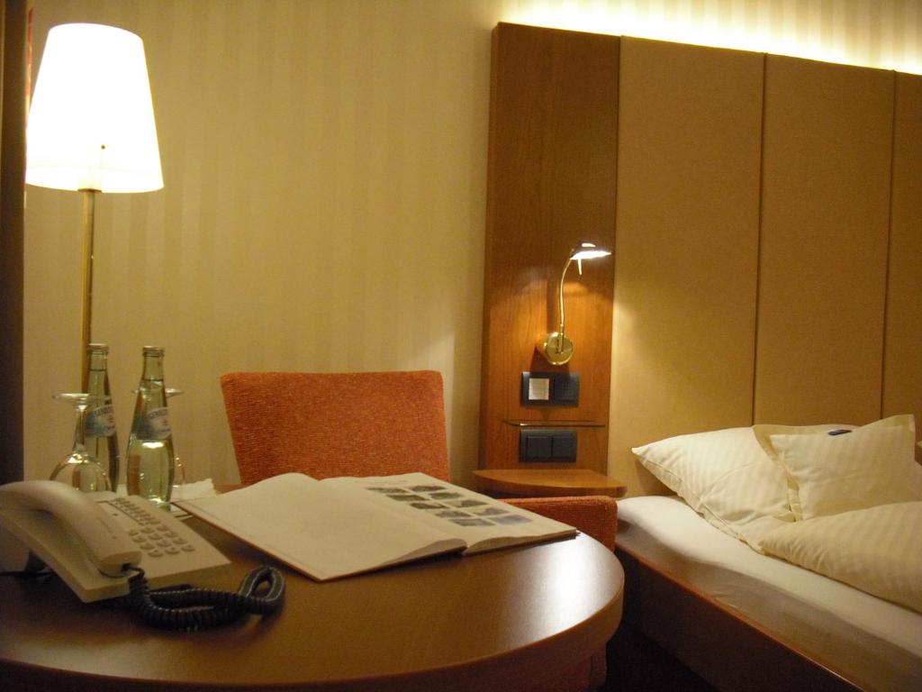 Postel nebo postele na pokoji v ubytování Hotel Hanken GmbH, Hotel Hanken und Seehotel