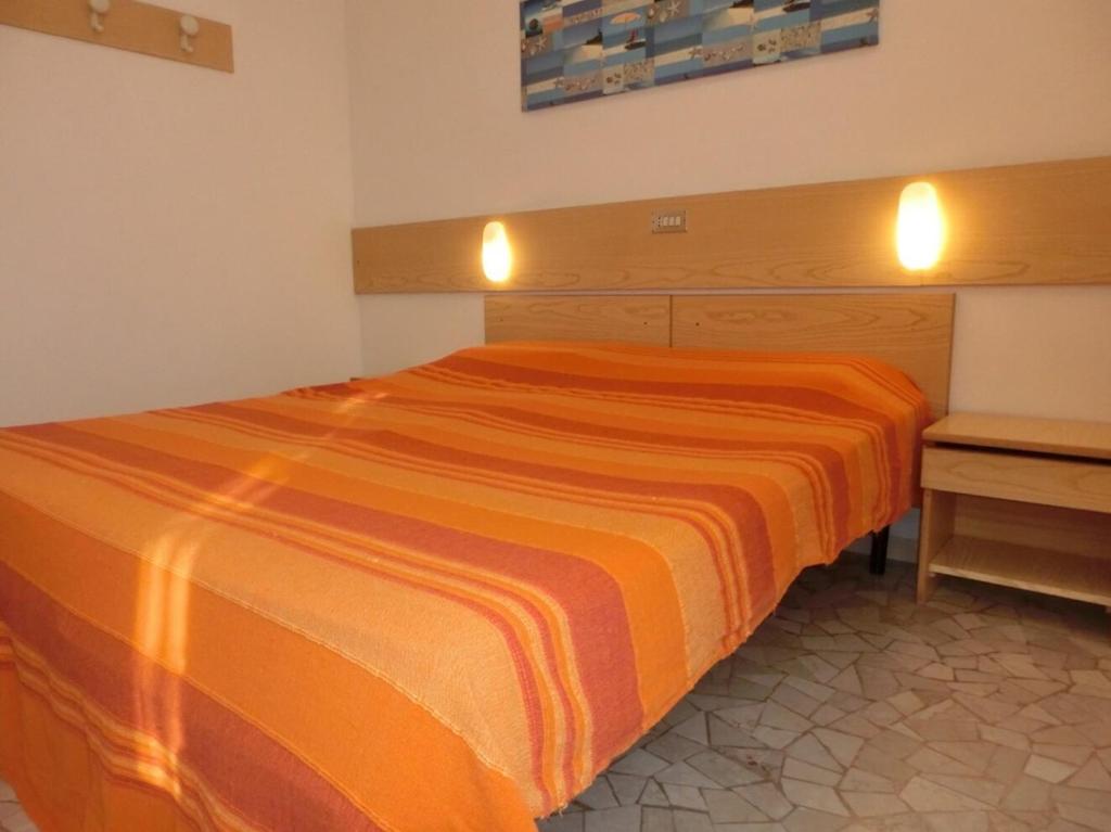 A bed or beds in a room at Adorable Villa for 8 people close to the sea