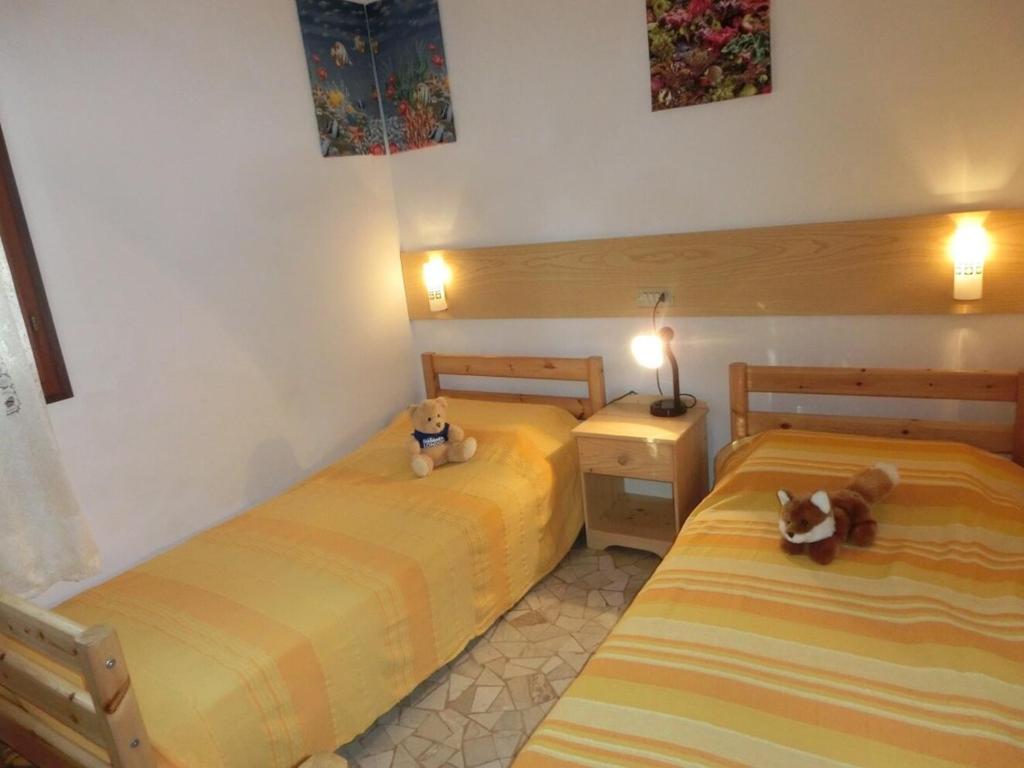 A bed or beds in a room at Adorable Villa for 8 people close to the sea