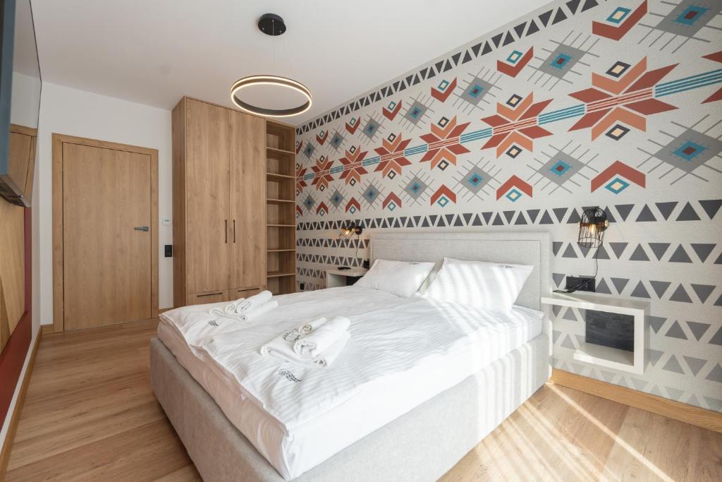 Posteľ alebo postele v izbe v ubytovaní Apartamenty Pod Gondolą - Mountain Resort Villa z sauną - Dream Apart