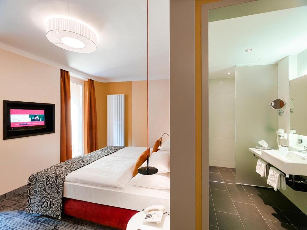 Posteľ alebo postele v izbe v ubytovaní Hotel Capricorno