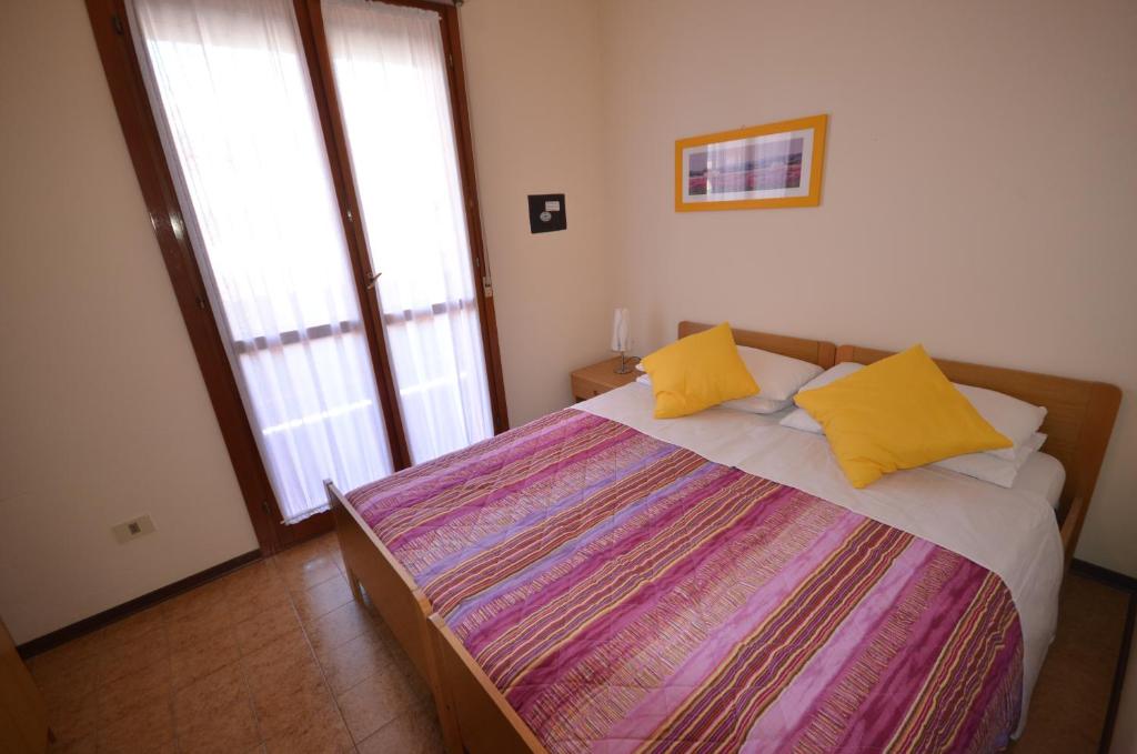 A bed or beds in a room at Residence Valbella