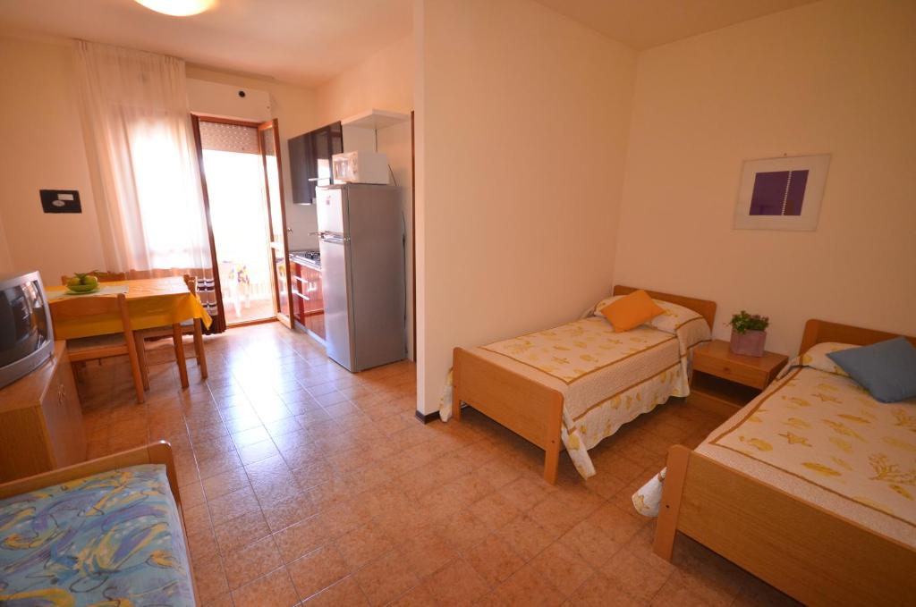 A bed or beds in a room at Residence Valbella