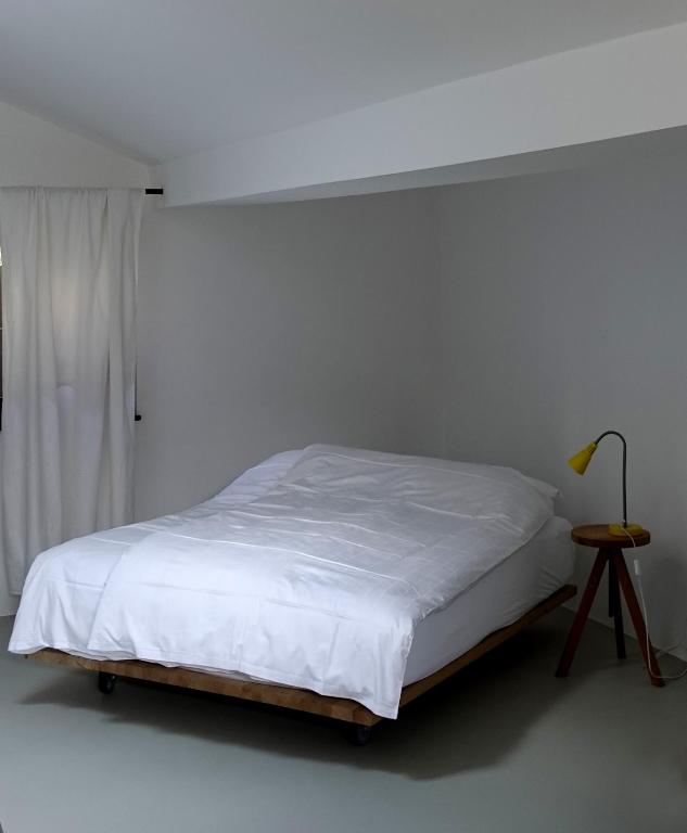 Postel nebo postele na pokoji v ubytování Bretzenstudios