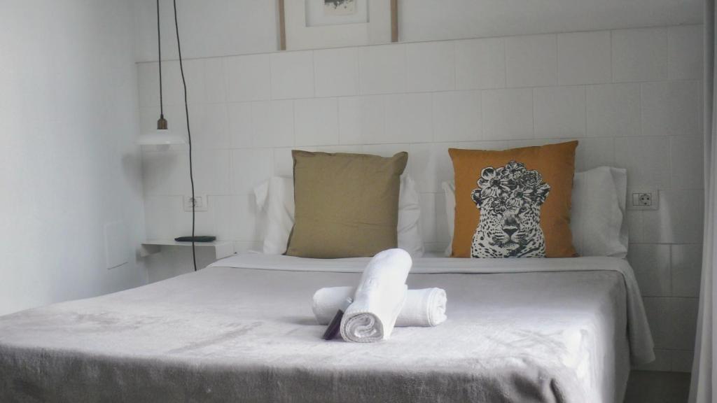 Posteľ alebo postele v izbe v ubytovaní Hostal Argo