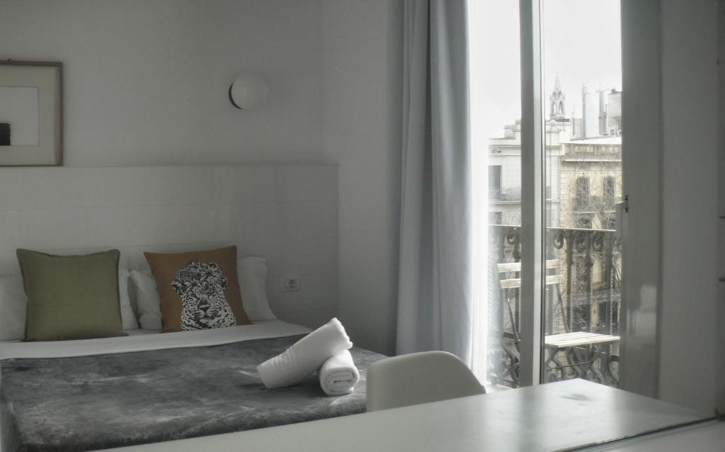 Posteľ alebo postele v izbe v ubytovaní Hostal Argo