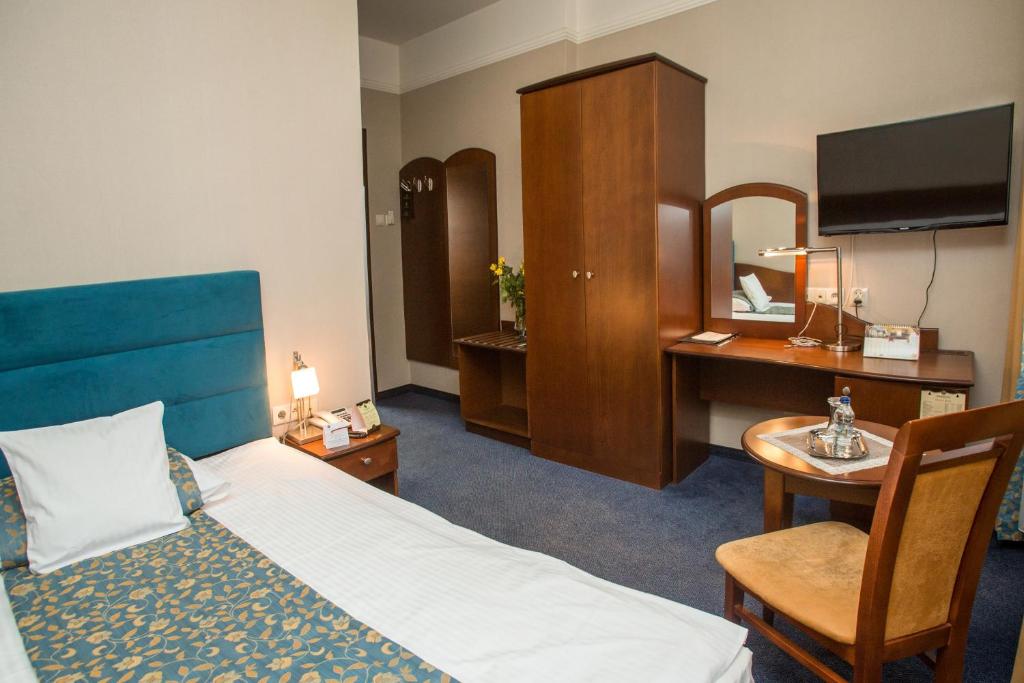Posteľ alebo postele v izbe v ubytovaní Hotel Ambasadorski Rzeszów
