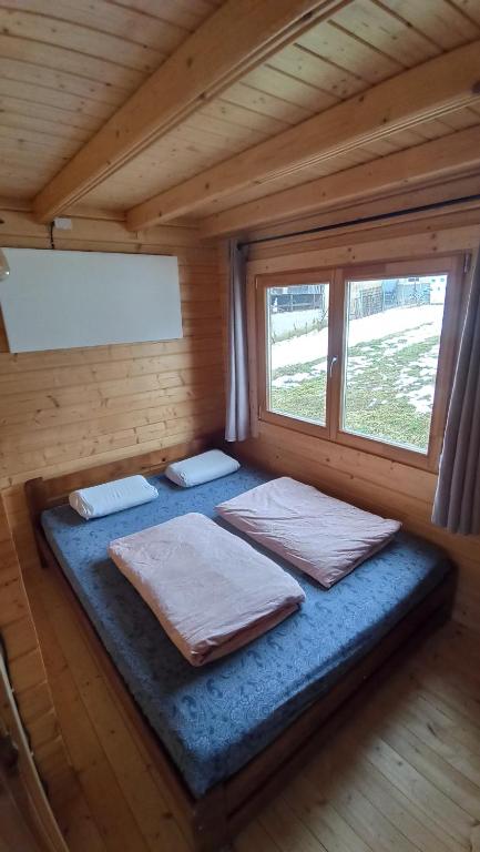 A bed or beds in a room at Happy Cottage