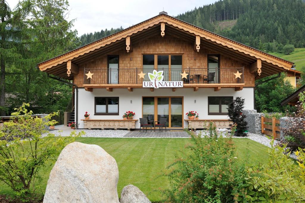 a guest house in the mountains with a garden at UR-NATUR Appartements in Maria Alm am Steinernen Meer