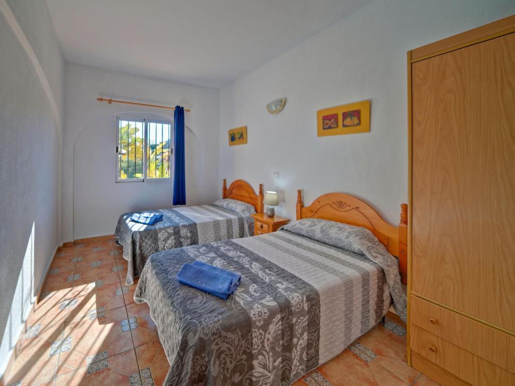 Postel nebo postele na pokoji v ubytování Apartment Canuta Baja-1 by Interhome