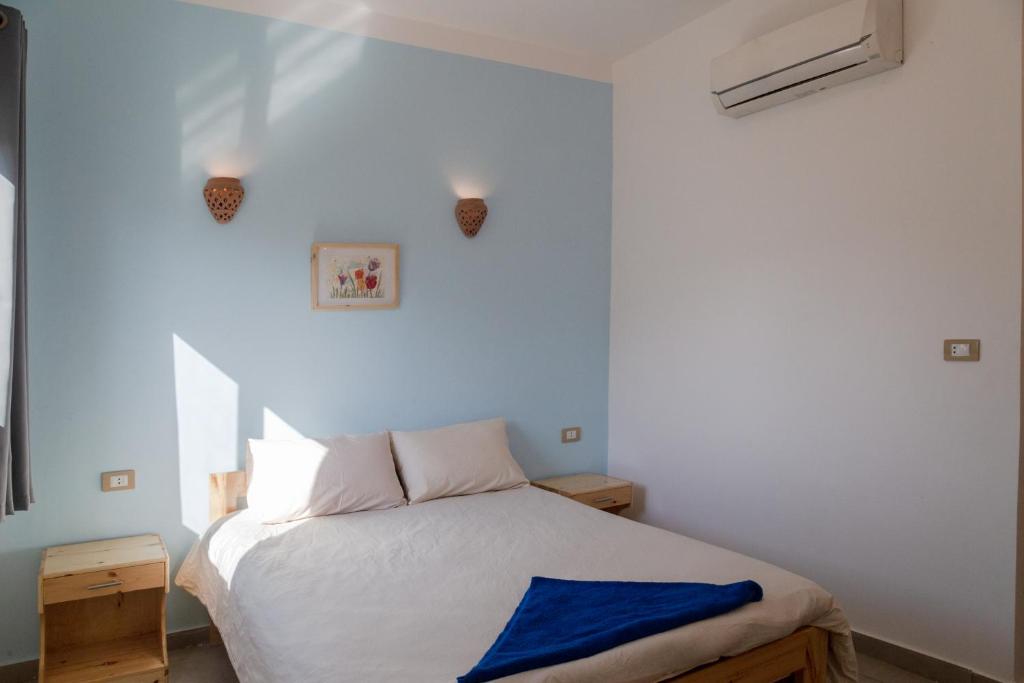 Postel nebo postele na pokoji v ubytování Al Deira Dahab Hotel