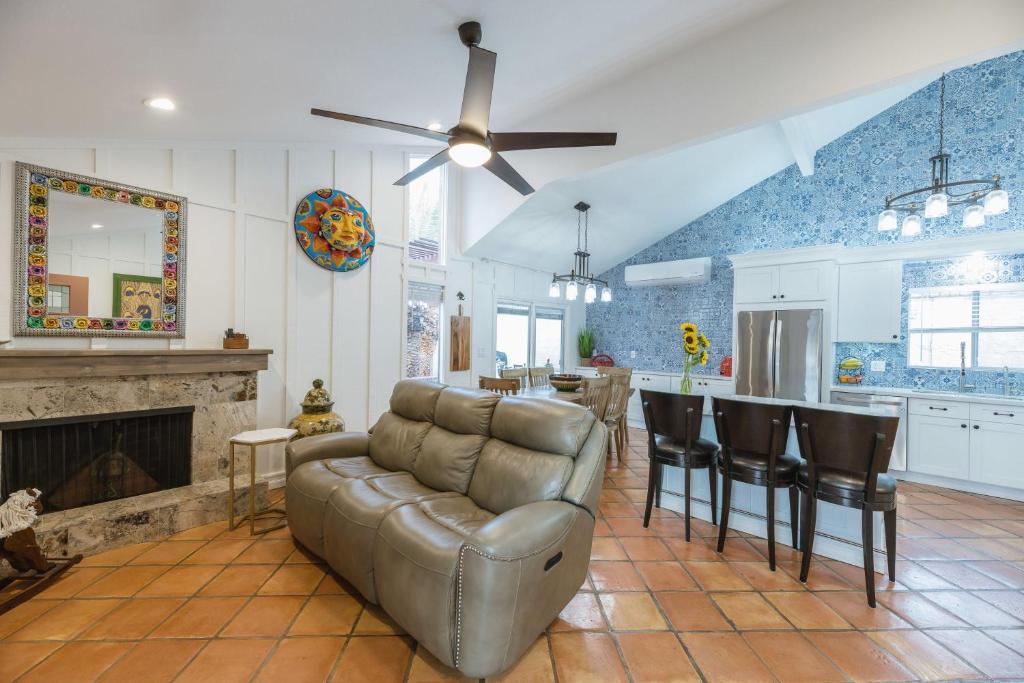 a living room with a couch and a kitchen at Sunset Lane in Tempe