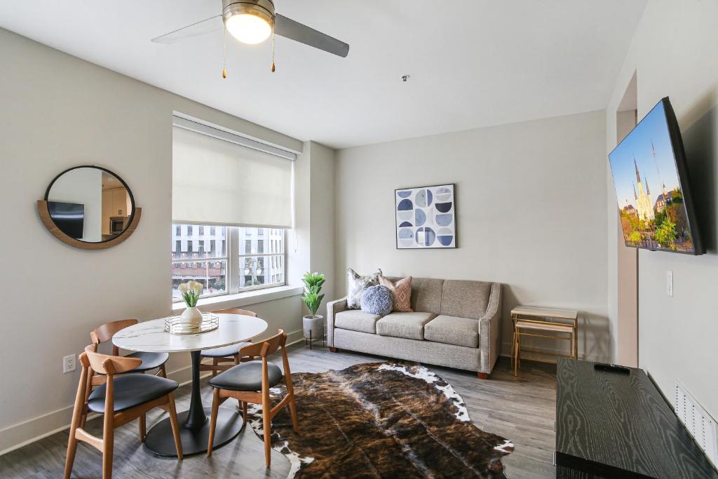 a living room with a table and a couch at Pet-Friendly Spacious condos in Downtown New Orleans in New Orleans