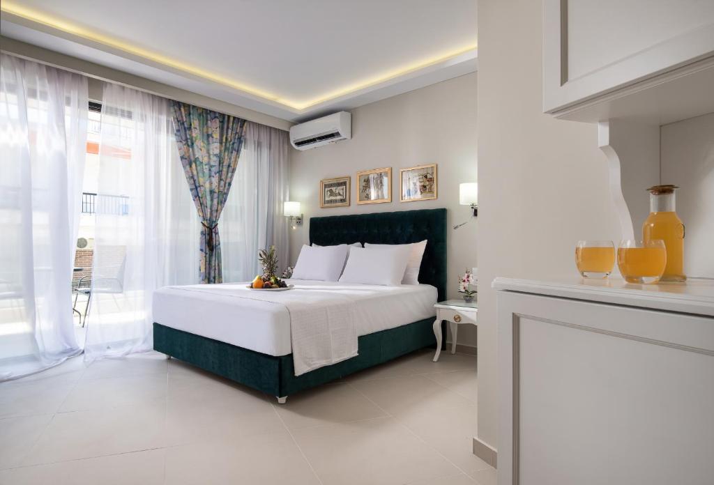 Postel nebo postele na pokoji v ubytování Light Blue Hotel