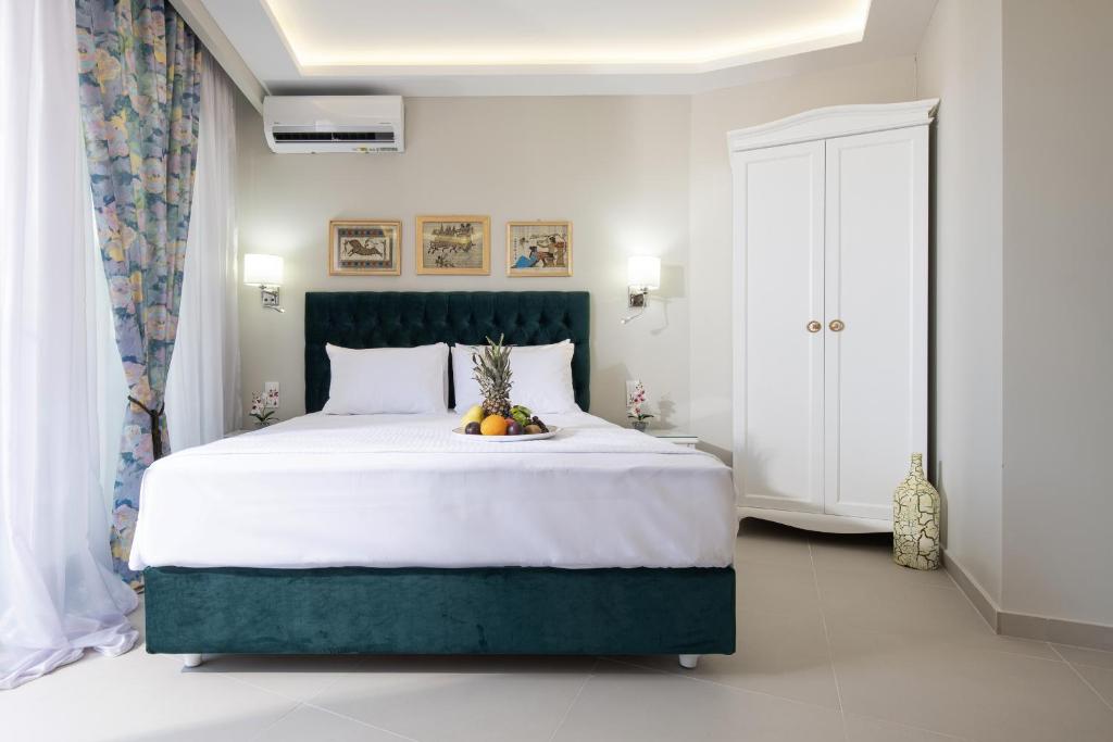 Postel nebo postele na pokoji v ubytování Light Blue Hotel