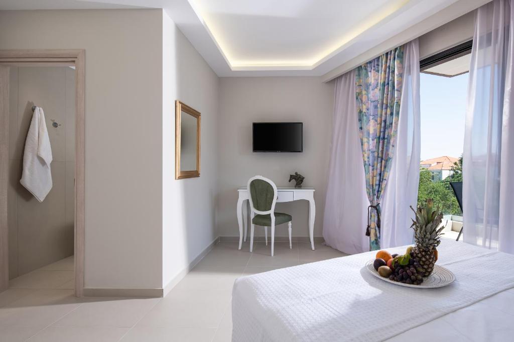 TV a/nebo společenská místnost v ubytování Light Blue Hotel