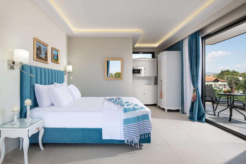 Postel nebo postele na pokoji v ubytování Light Blue Hotel