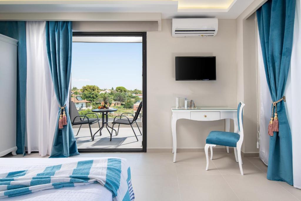 Postel nebo postele na pokoji v ubytování Light Blue Hotel
