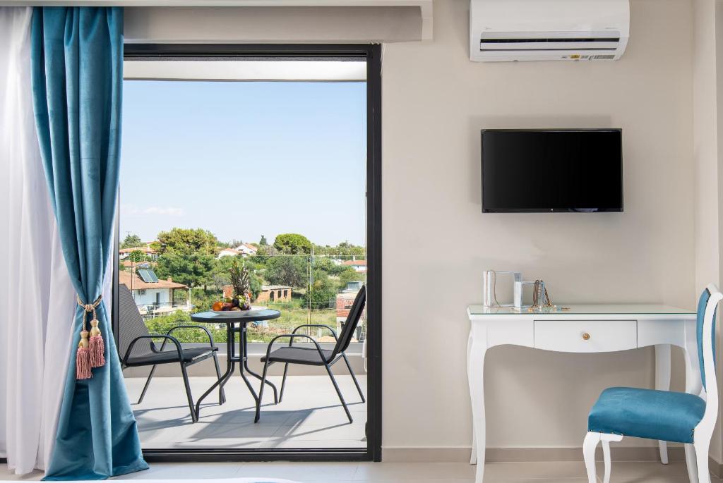 TV a/nebo společenská místnost v ubytování Light Blue Hotel