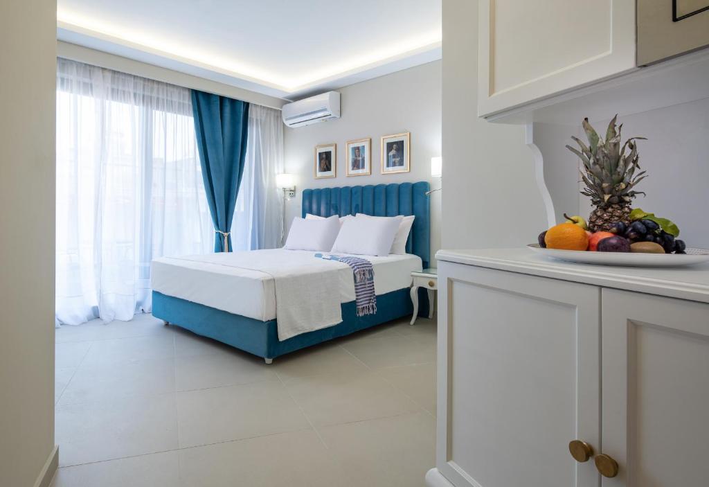 Postel nebo postele na pokoji v ubytování Light Blue Hotel