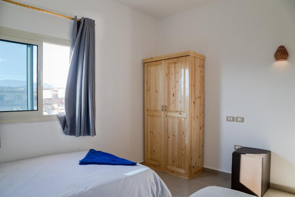 Postel nebo postele na pokoji v ubytování Al Deira Dahab Hotel