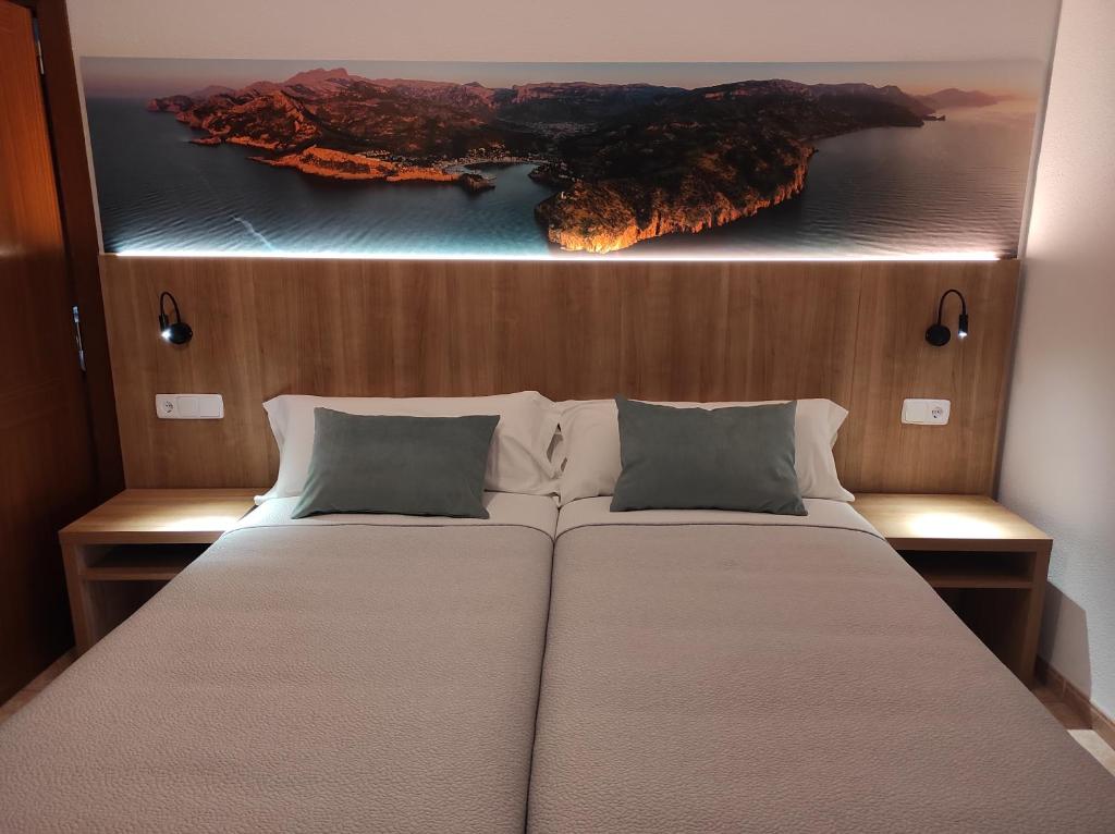 Postel nebo postele na pokoji v ubytování Hostal Nadal