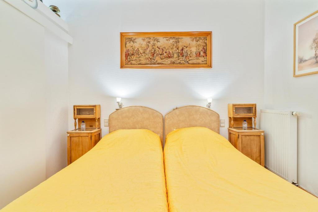 Postel nebo postele na pokoji v ubytování Elckerlyck Inn Hotel
