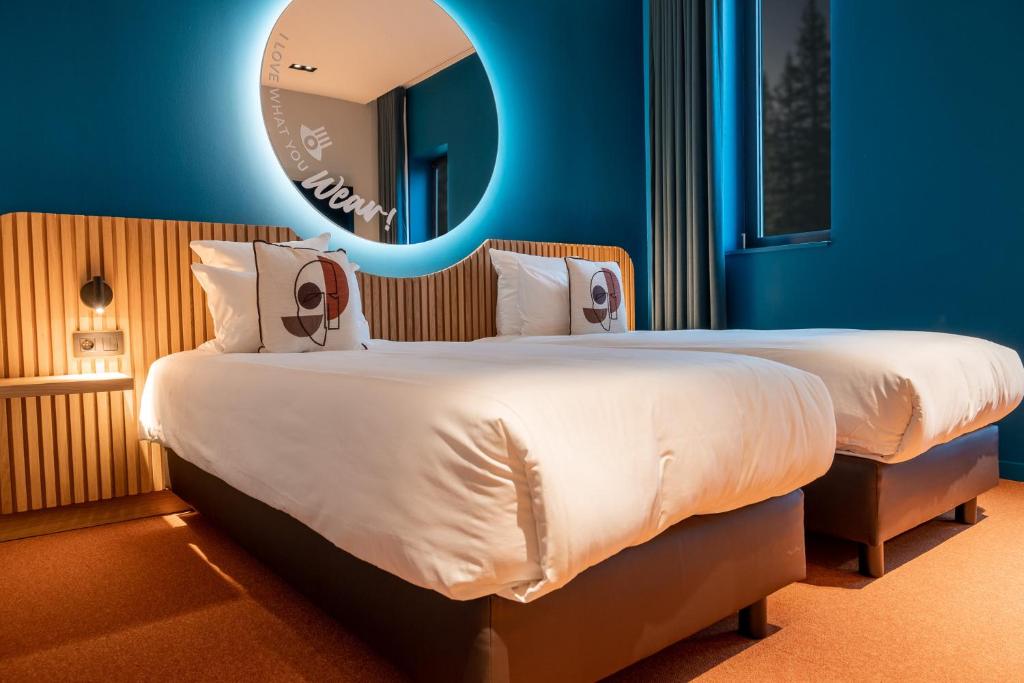Postel nebo postele na pokoji v ubytování Mah Hotel