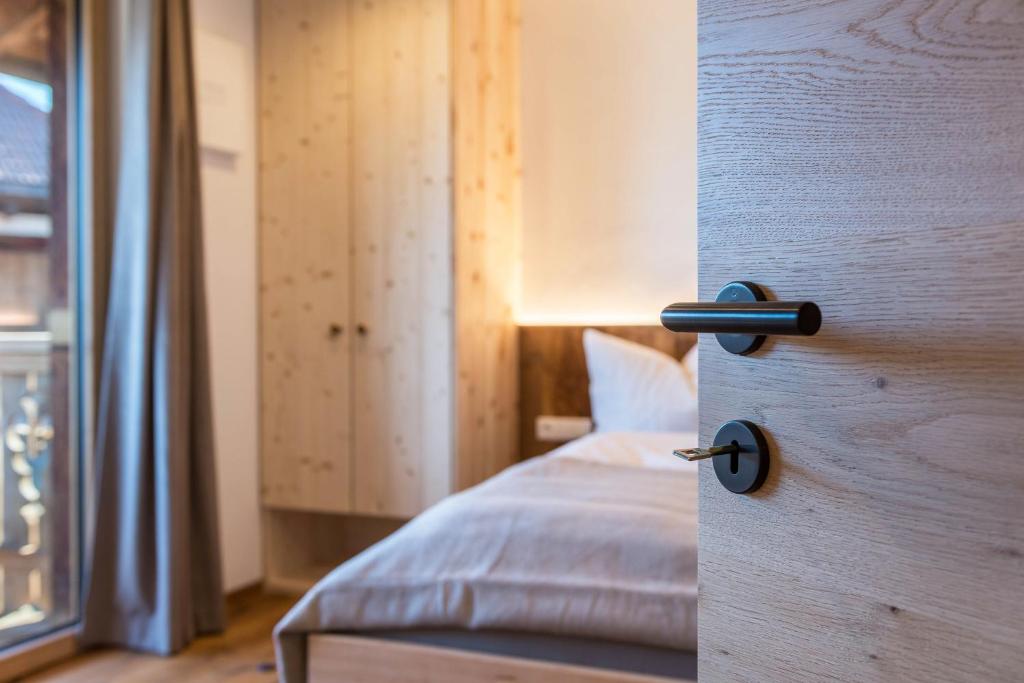 Postel nebo postele na pokoji v ubytování Aschnerhof Holzhitt