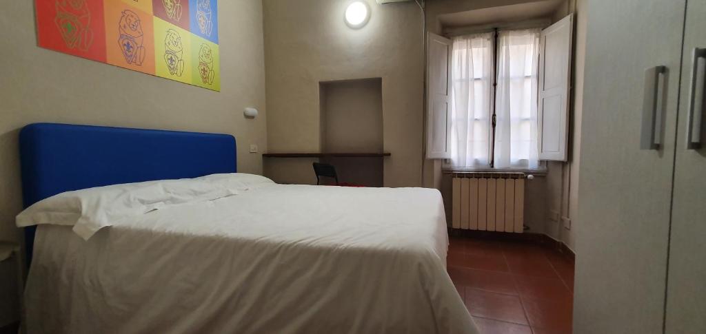 Łóżko lub łóżka w pokoju w obiekcie Hotel Genesi