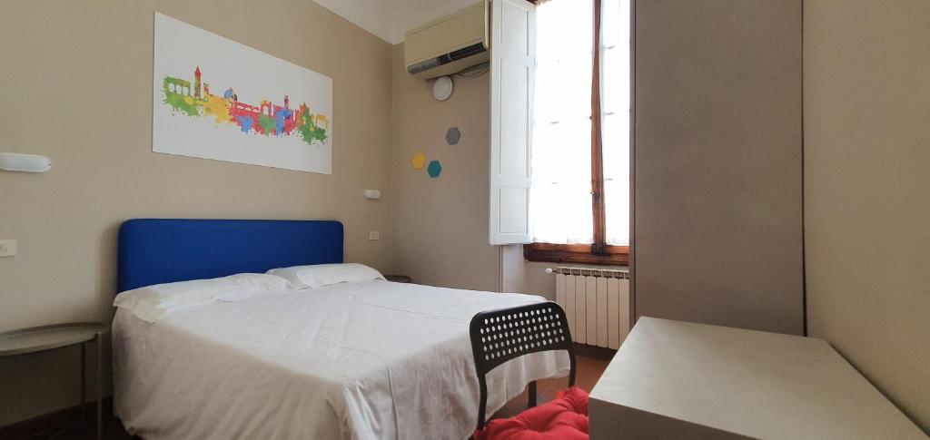 Łóżko lub łóżka w pokoju w obiekcie Hotel Genesi