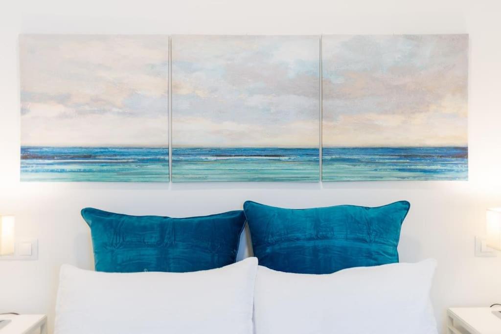 A bed or beds in a room at Puccini Oasis - Gianni Schicci