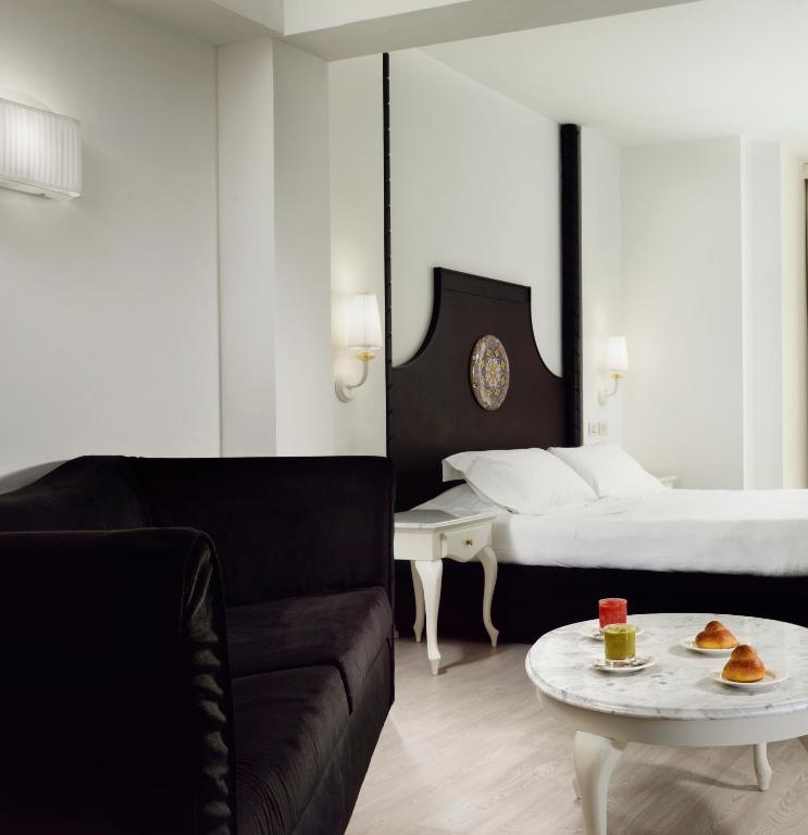 A bed or beds in a room at Palace Catania | UNA Esperienze