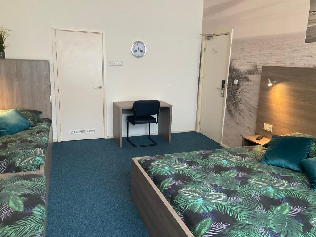 Postel nebo postele na pokoji v ubytování Hotel Poseidon