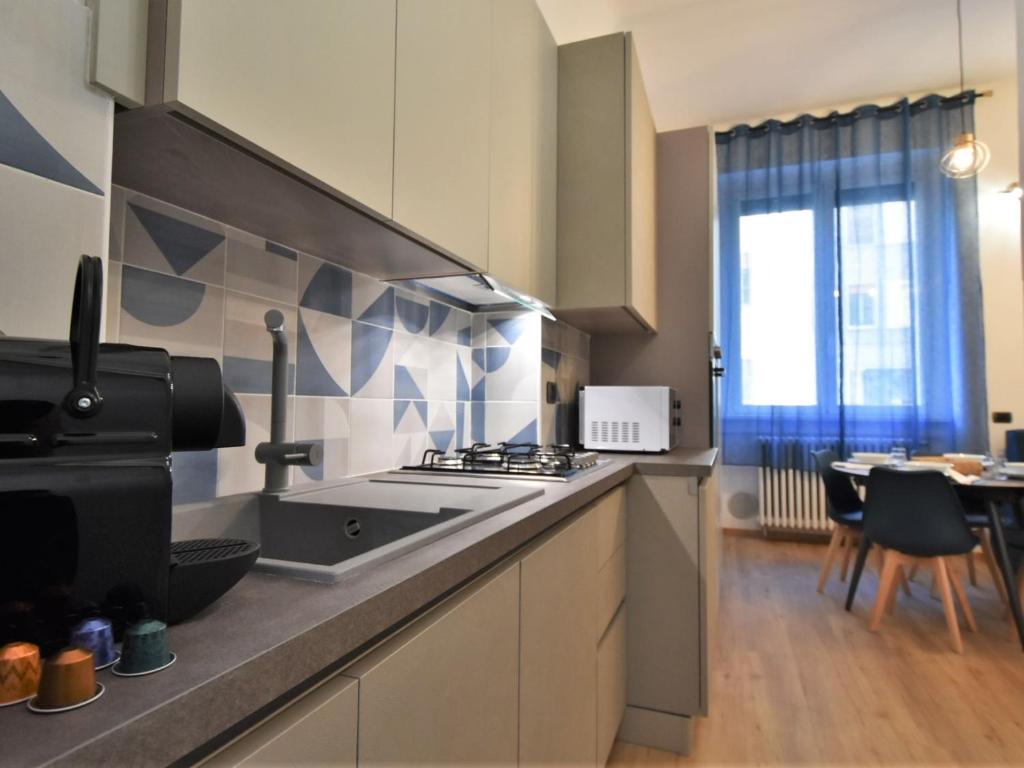 A kitchen or kitchenette at Apartment NoLo Flat by Interhome